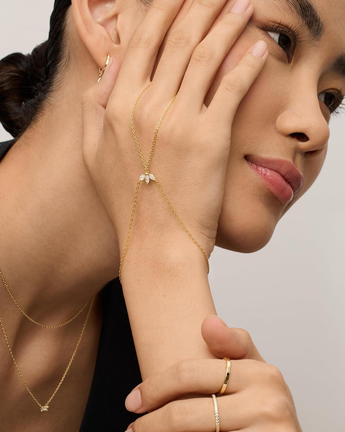 imagePAVOI 14K Gold Plated Hand Chains for Women  Adjustable Hand Chain Bracelet and Ring  Trendy Gold Handchain Bracelet Stack Summer Jewelry  Beads Pearl and Cubic Zirconia Body JewelryWhite Gold