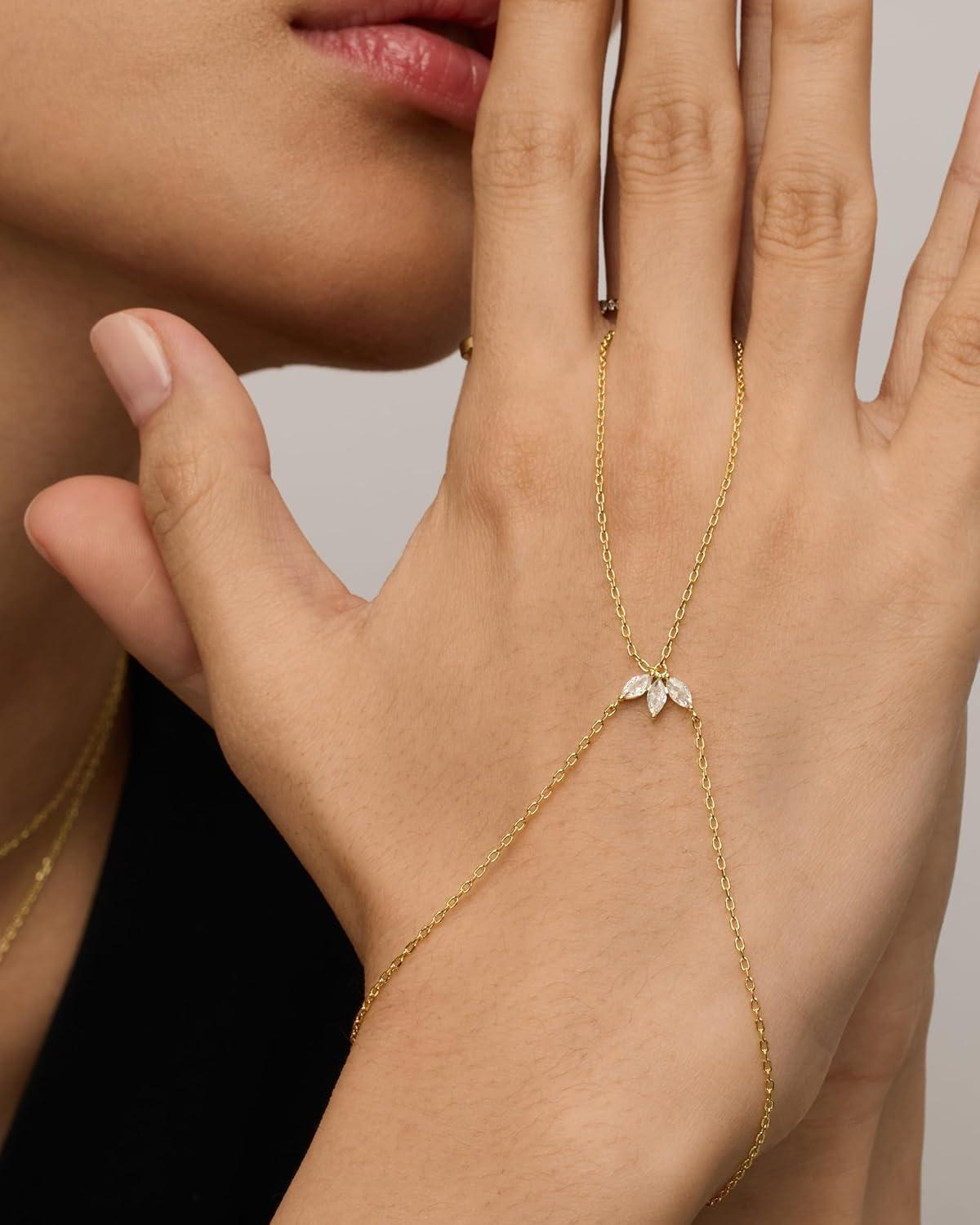 imagePAVOI 14K Gold Plated Hand Chains for Women  Adjustable Hand Chain Bracelet and Ring  Trendy Gold Handchain Bracelet Stack Summer Jewelry  Beads Pearl and Cubic Zirconia Body JewelryWhite Gold