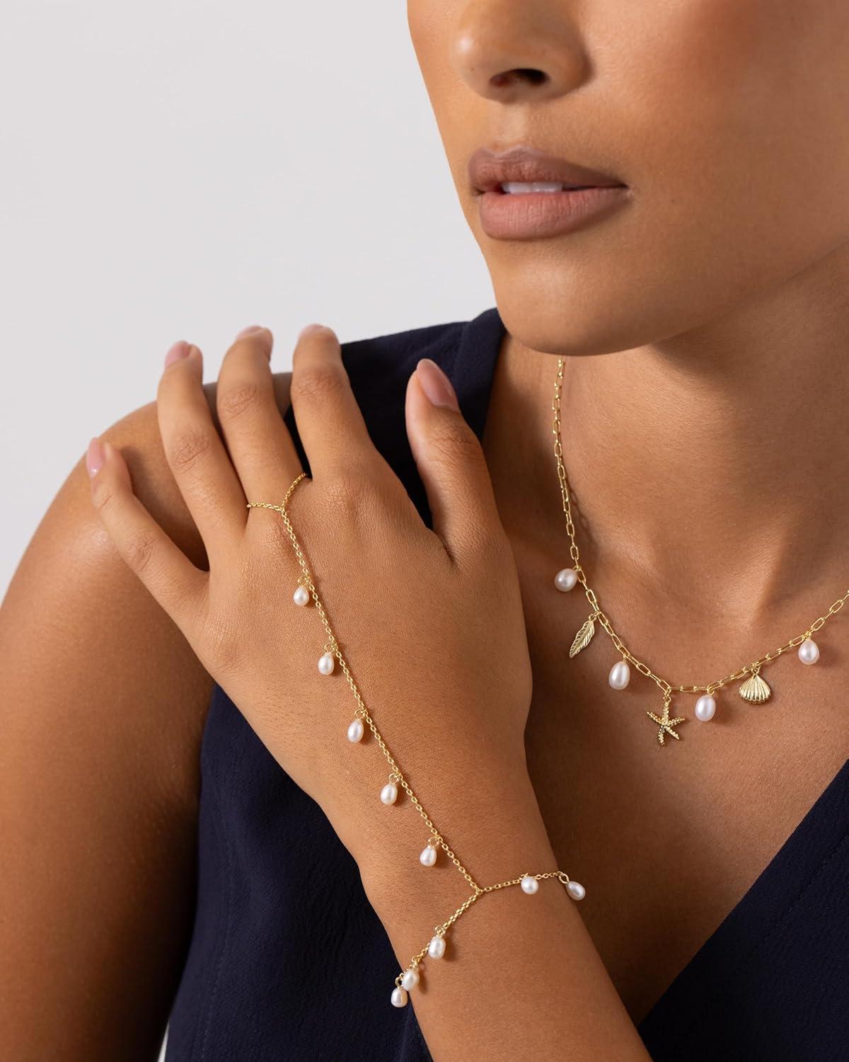imagePAVOI 14K Gold Plated Hand Chains for Women  Adjustable Hand Chain Bracelet and Ring  Trendy Gold Handchain Bracelet Stack Summer Jewelry  Beads Pearl and Cubic Zirconia Body JewelryWhite Gold