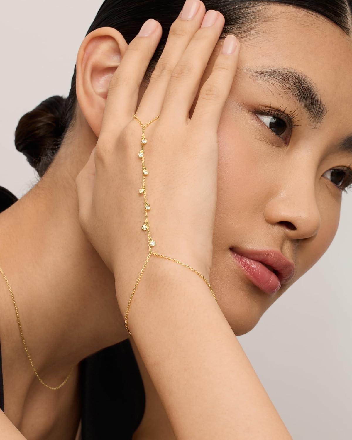 imagePAVOI 14K Gold Plated Hand Chains for Women  Adjustable Hand Chain Bracelet and Ring  Trendy Gold Handchain Bracelet Stack Summer Jewelry  Beads Pearl and Cubic Zirconia Body JewelryWhite Gold